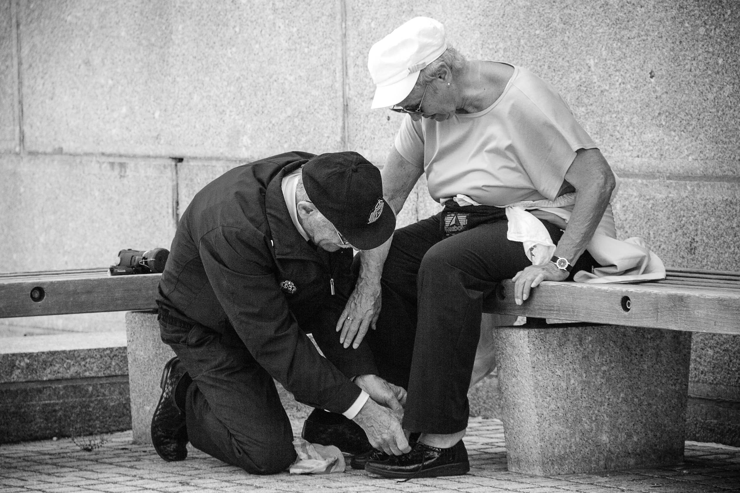 Elder-Man-Helping-Elder-Woman-to-Tie-Her-Shoes